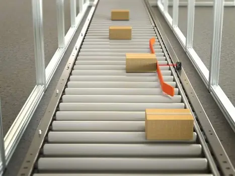 The Q20-2 sensor being used in a push-arm alignment conveyor application to align packages